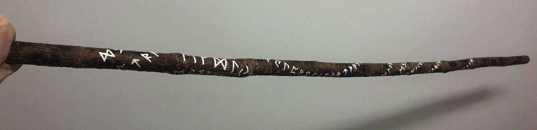 A wooden staff containing hundreds of runes.