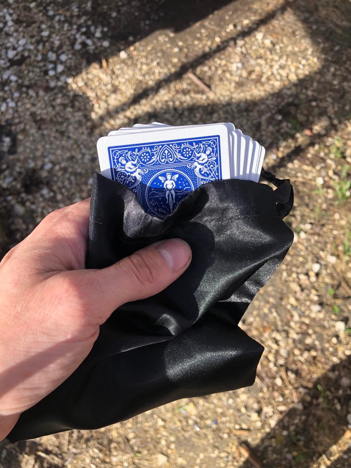 The set of blue cards, pulled partially from the sack.