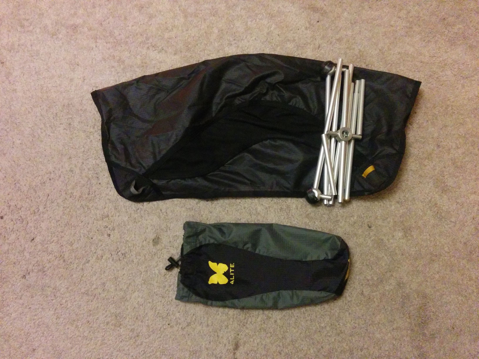 The camping chair, shown unpacked from its bag but still folded up.