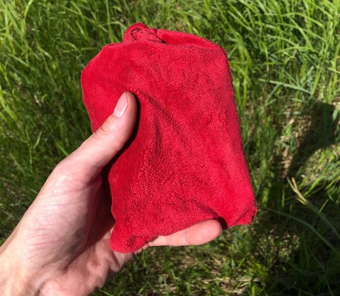 Holding the pouch in the swamp, it has a beautiful colour, just a shade darker, and a different texture too, just a bit rough.