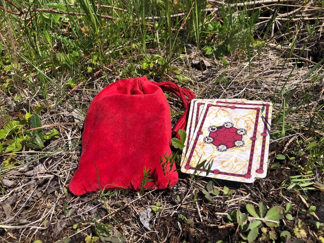 A glorious red pouch, for a deck of cards beside