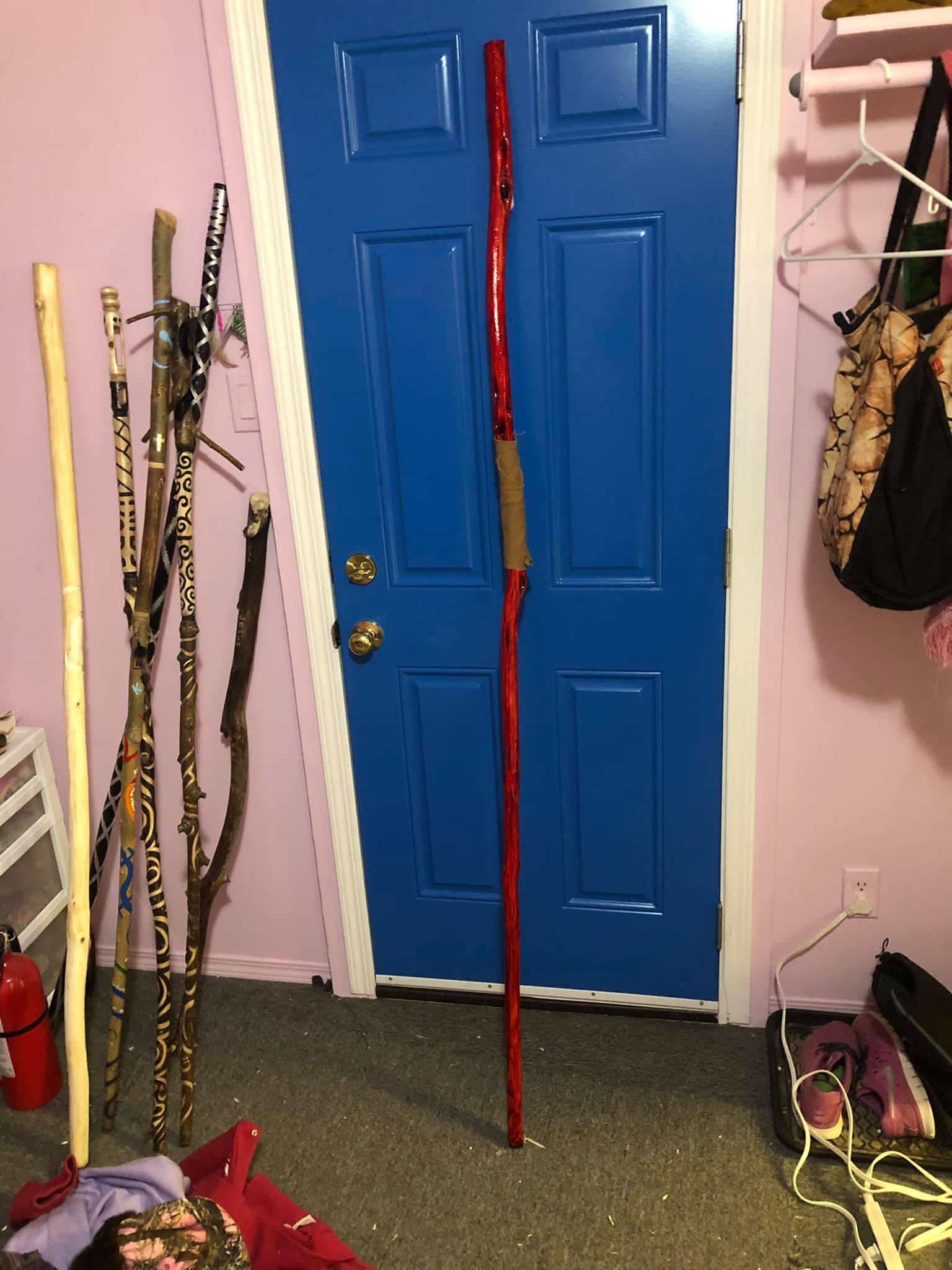 A photo of the staff of screaming, here labelled the blood staff, against the door of the apartment.