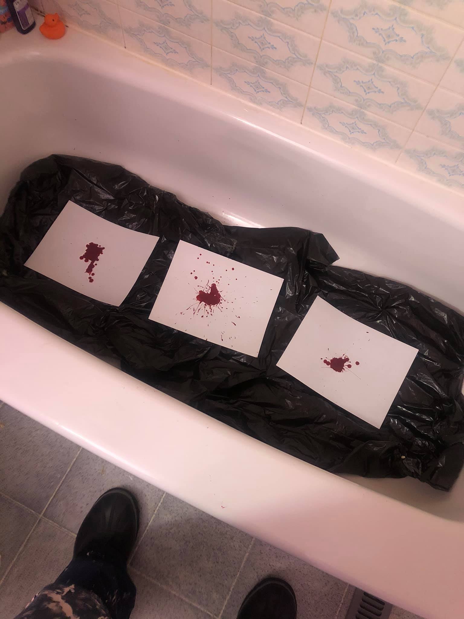 Three bloody pools on three canvases in the tub.
