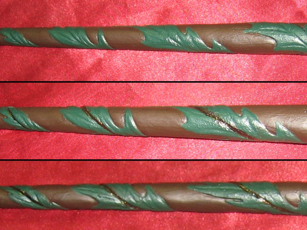 Showing the leaves painted in a brownish forest green, with darker brown stems.