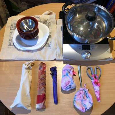 A hotpot setup with all of the necessary tools contained in bespoke sewn pouches.