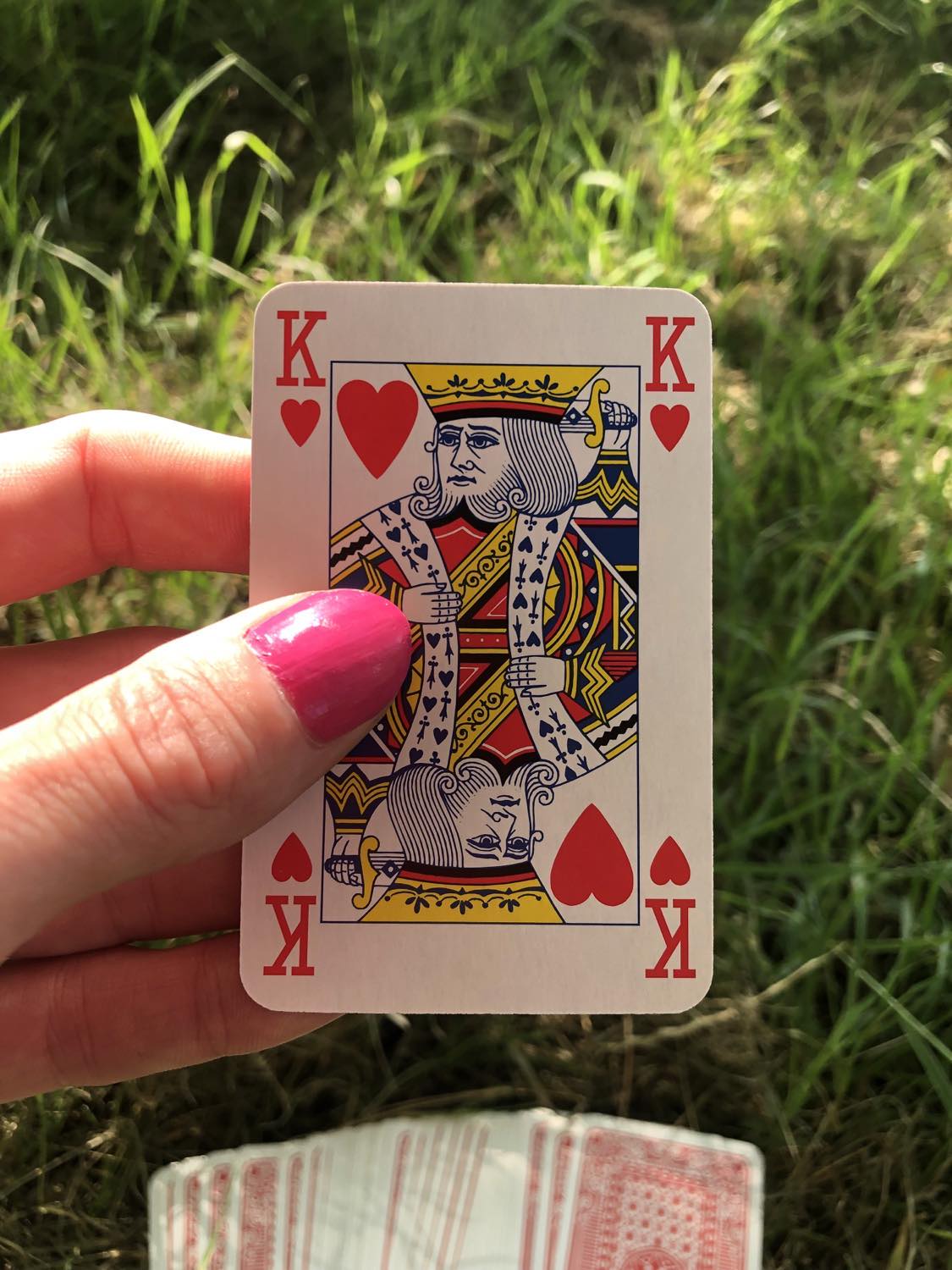 The king of hearts, held up from the drawn out cards.