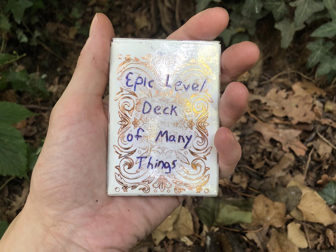 The Epic Level Deck of Many Things rests in your hand above the foliage, strangely dry and pristine.